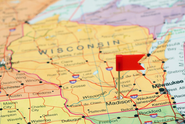 Photo of pinned Madison on a map of USA.